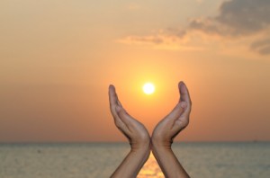 Hands Held Up in Sky